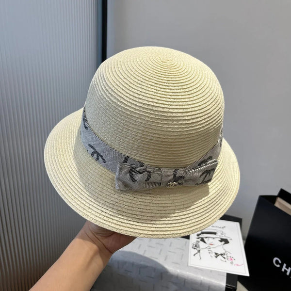STRAW BUCKET HAT IN IVORY WITH RIBBON BOW 673977