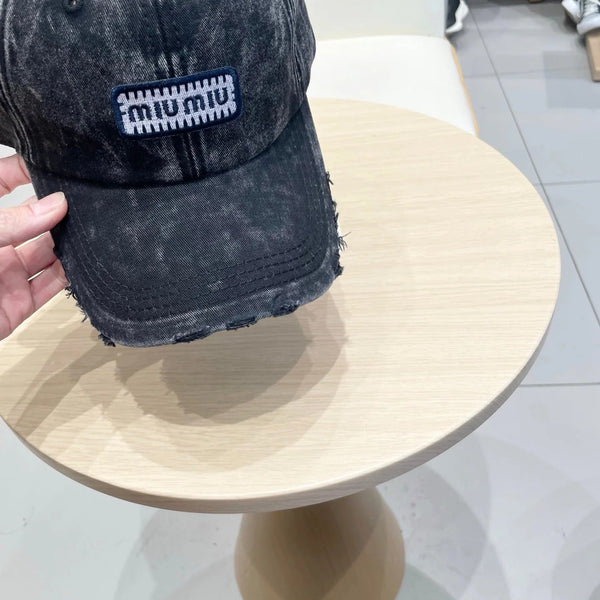 MM DISTRESSED FABRIC BASEBALL CAP IN BLACK WITH EMBROIDERED LOGO